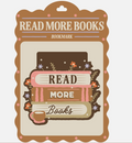 A decorative bookmark card with the phrase 'READ MORE BOOKS' and 'BOOKMARK' printed at the top, featuring an illustrated stack of books, small flowers, leaves, and a coffee cup on a cream background.