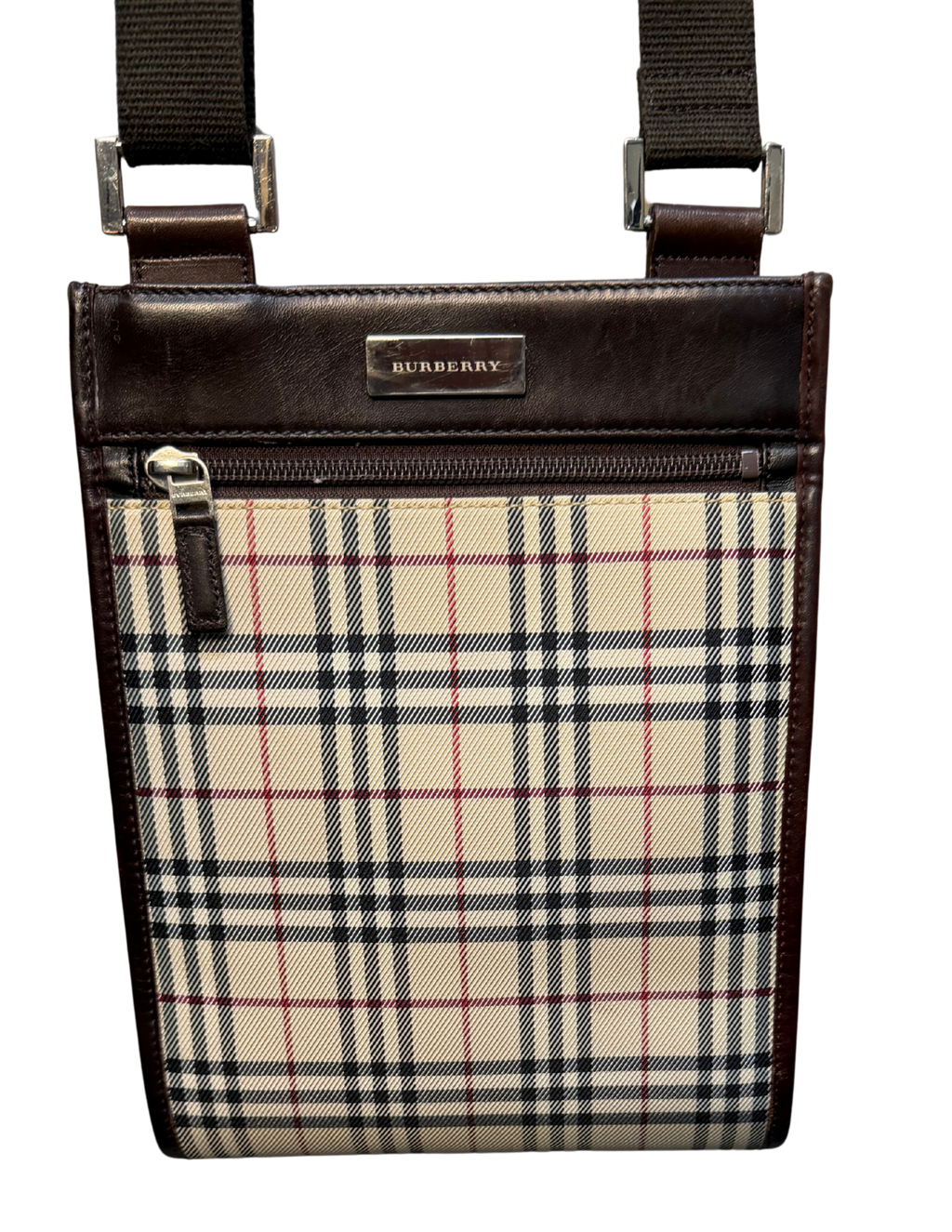 Burberry crossbody bag with plaid pattern and brown leather accents on a white background