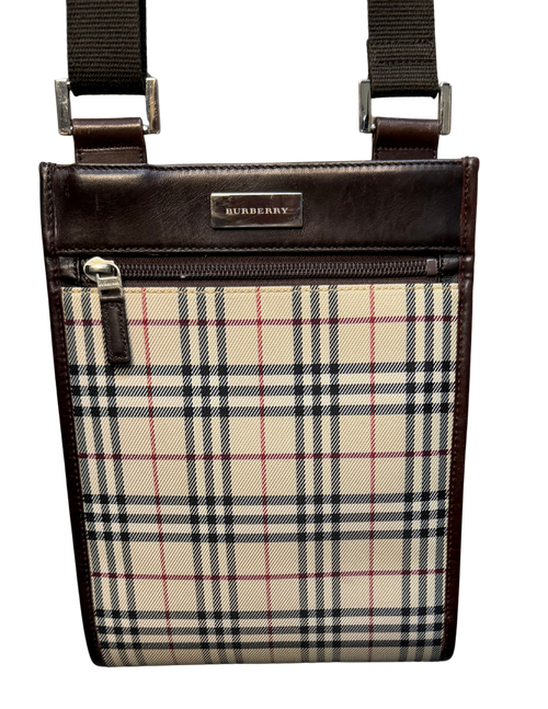 Burberry crossbody bag with plaid pattern and brown leather accents on a white background