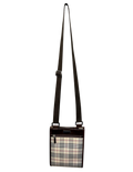 Plaid patterned crossbody bag on a white background