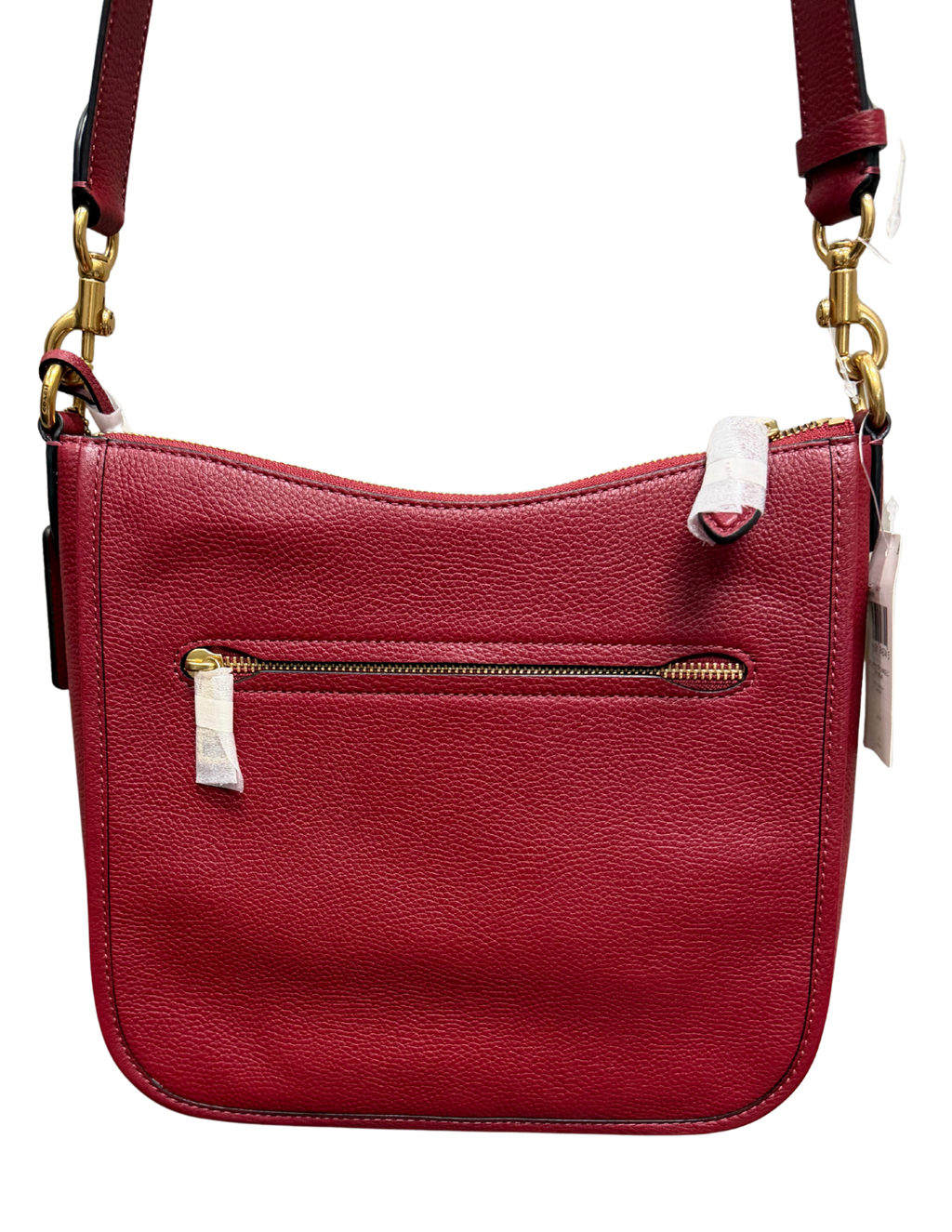 Red handbag with gold zipper and strap on a white background