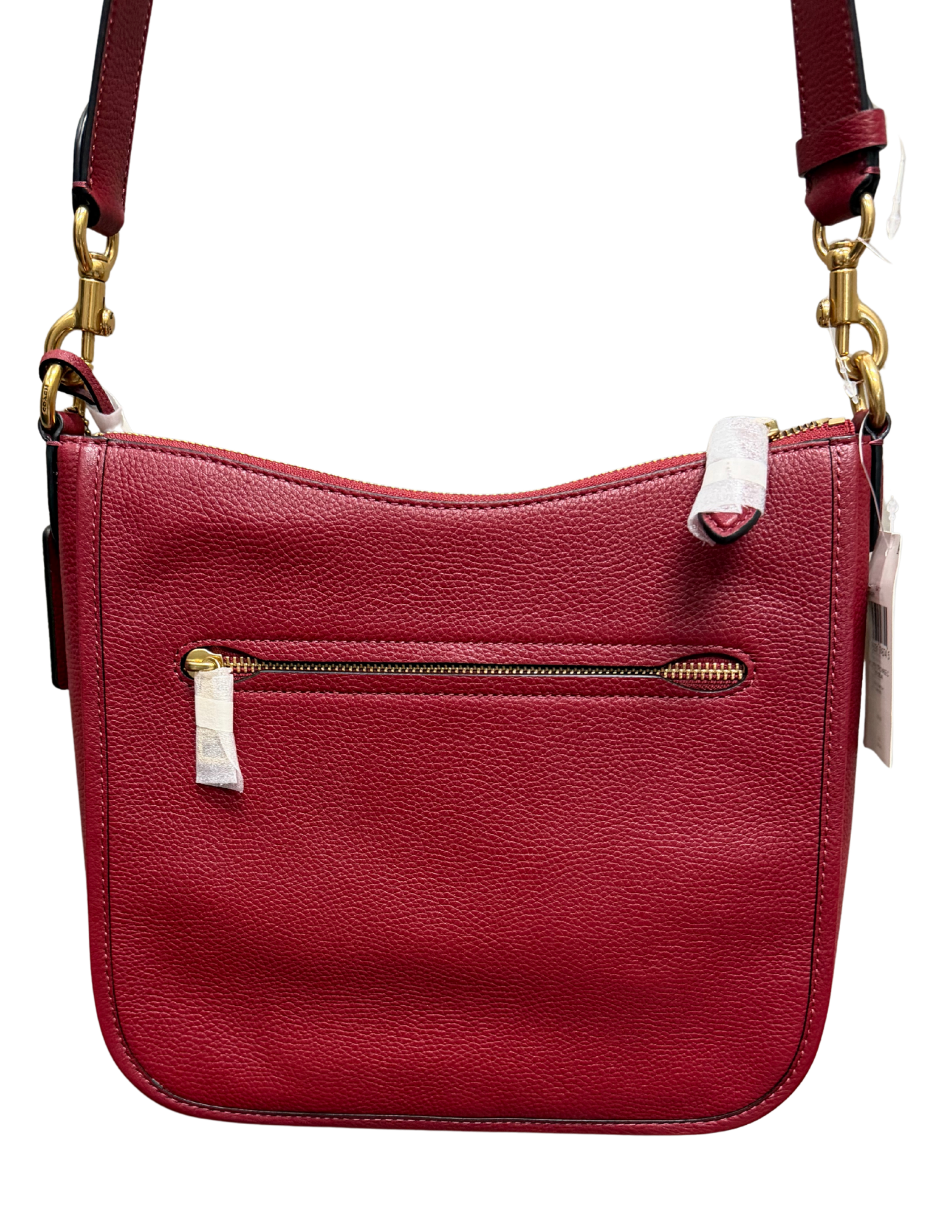 Red handbag with gold zipper and strap on a white background